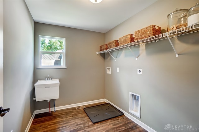 washroom with electric dryer hookup, hookup for a washing machine, and dark hardwood / wood-style flooring