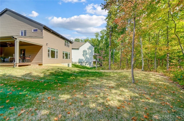 view of yard with a wooden deck