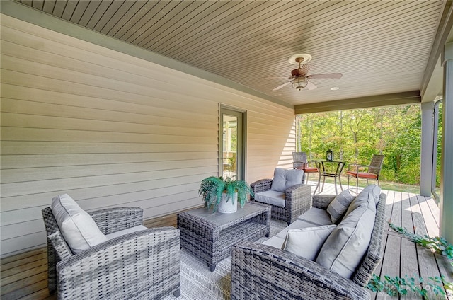 deck featuring outdoor lounge area and ceiling fan