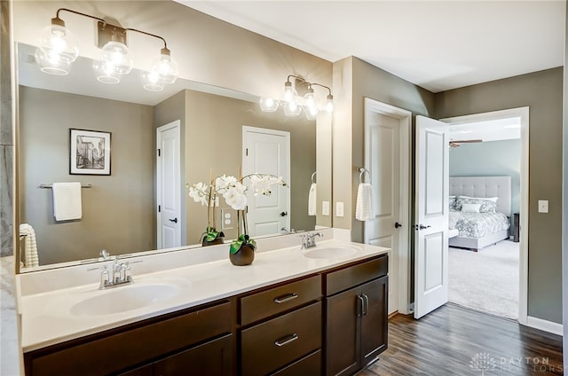 bathroom featuring vanity, hardwood / wood-style flooring, and ceiling fan