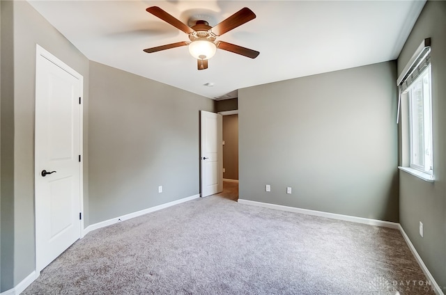 unfurnished bedroom with carpet flooring and ceiling fan