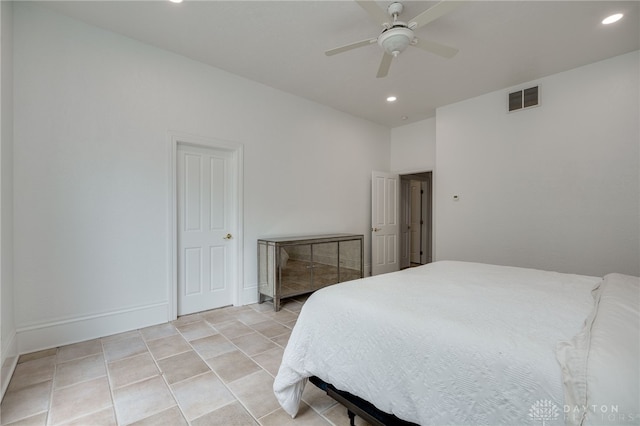 bedroom with ceiling fan and light tile patterned flooring