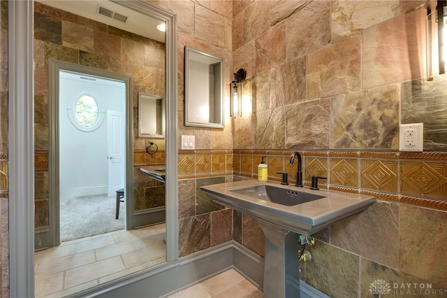 bathroom featuring tile walls and tile patterned floors