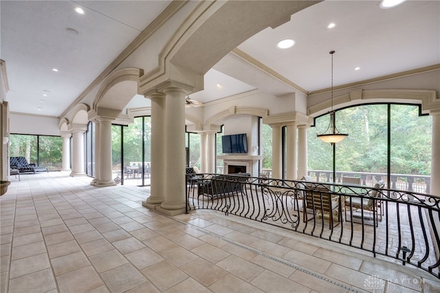 interior space with decorative columns and ornamental molding