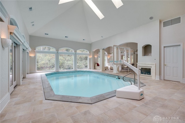 view of pool featuring a skylight