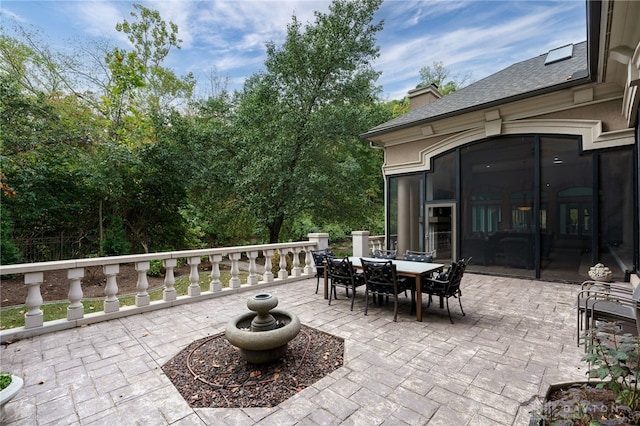 view of patio / terrace featuring a sunroom