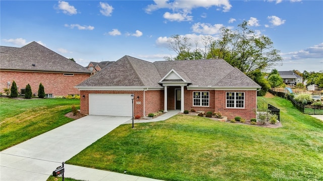 view of front of house featuring a front lawn and a garage