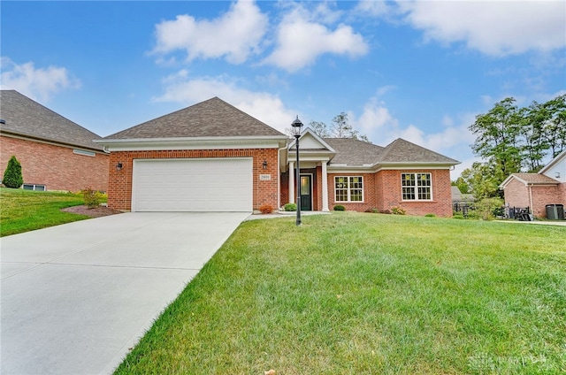 view of front of house featuring a front lawn and a garage