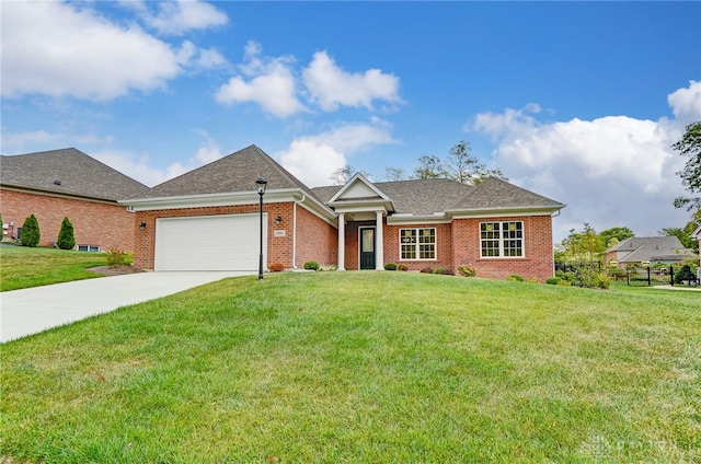 view of front of property featuring a garage and a front lawn