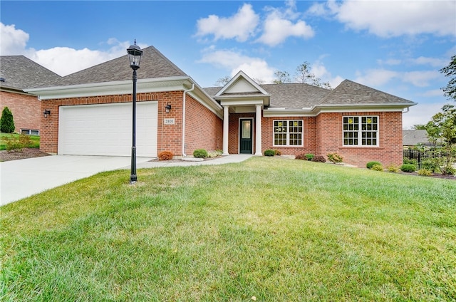 view of front of home featuring a garage and a front yard