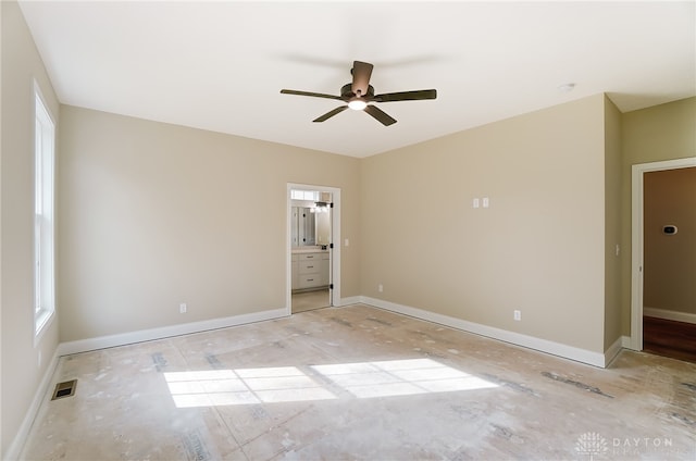 unfurnished bedroom with ceiling fan and ensuite bathroom