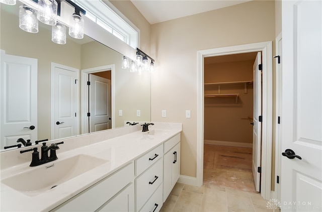 bathroom with vanity and tile patterned floors