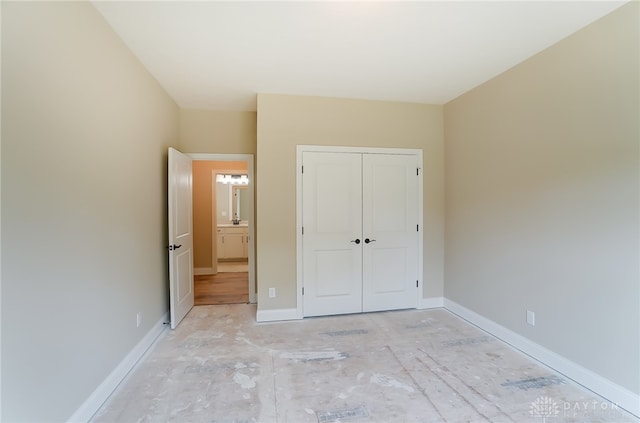 unfurnished bedroom with a closet