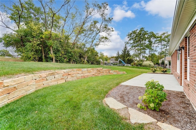 view of yard with a playground