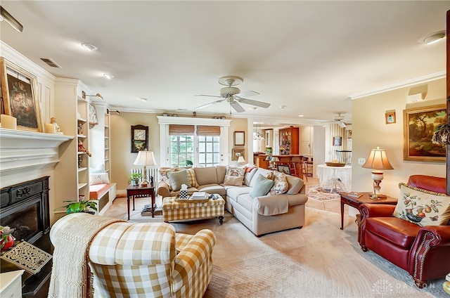 carpeted living room featuring ceiling fan and crown molding