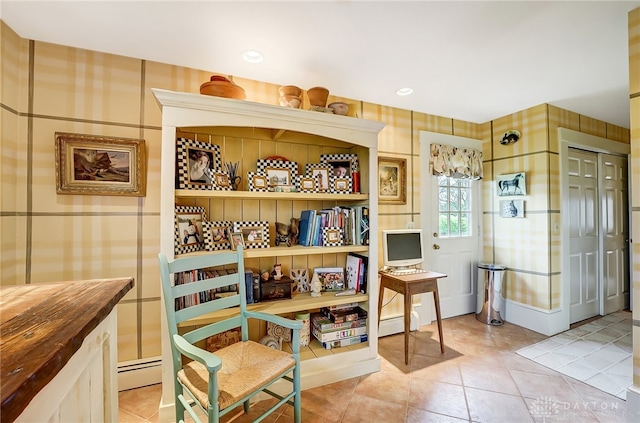 interior space featuring baseboard heating and light tile patterned flooring