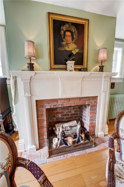 details with radiator and a fireplace