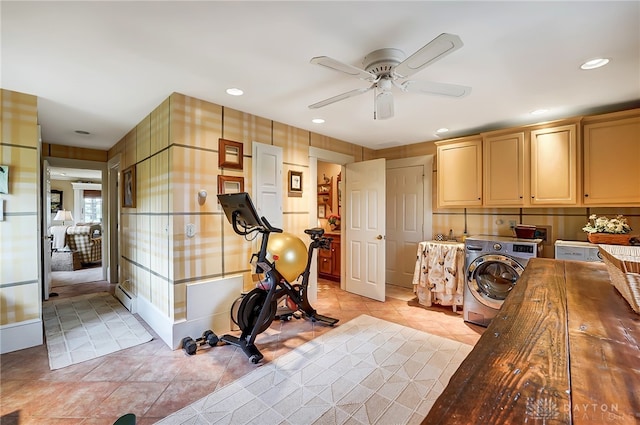 interior space featuring a baseboard heating unit, washer / clothes dryer, light tile patterned flooring, light brown cabinets, and ceiling fan