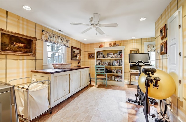 kitchen with fridge, ceiling fan, and tile countertops