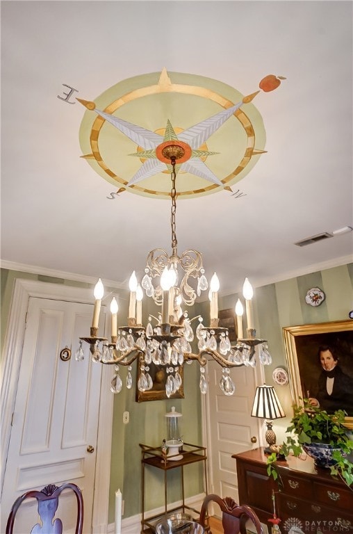 room details featuring a notable chandelier and crown molding