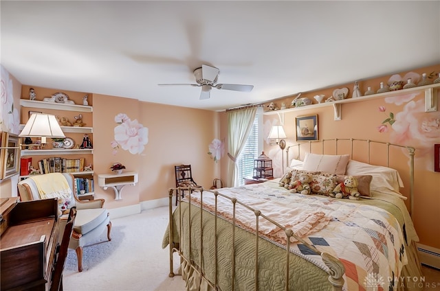 bedroom featuring ceiling fan, light colored carpet, and a baseboard radiator