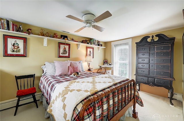 carpeted bedroom featuring ceiling fan and a baseboard radiator