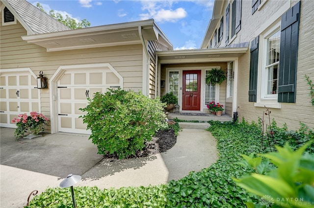 doorway to property featuring a garage