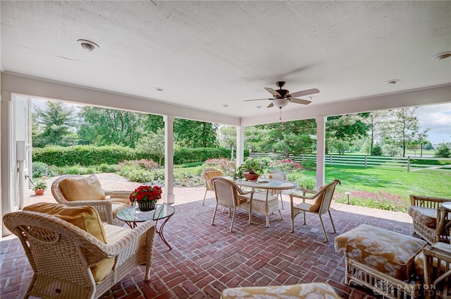 view of patio featuring ceiling fan