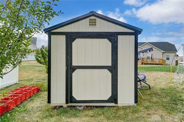 view of outdoor structure with a lawn