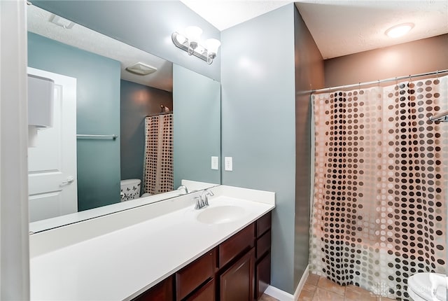 bathroom featuring vanity, toilet, and a shower with curtain