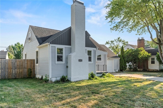 exterior space featuring a yard and a garage