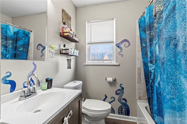 full bathroom featuring vanity, shower / bath combo with shower curtain, and toilet