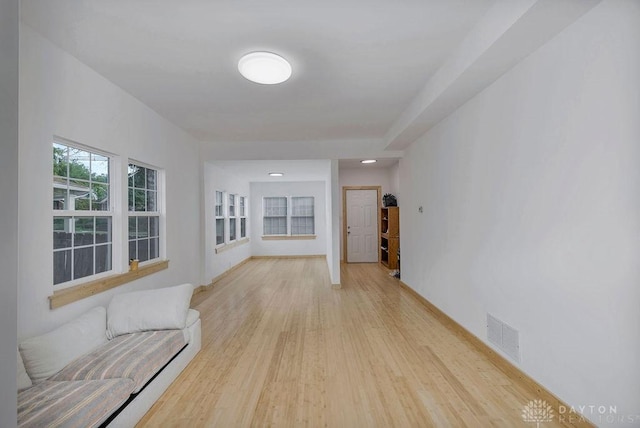 hall with light hardwood / wood-style flooring