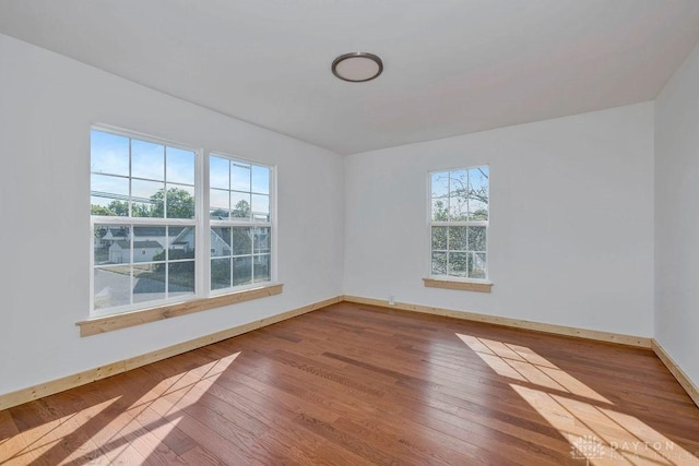 spare room featuring hardwood / wood-style floors