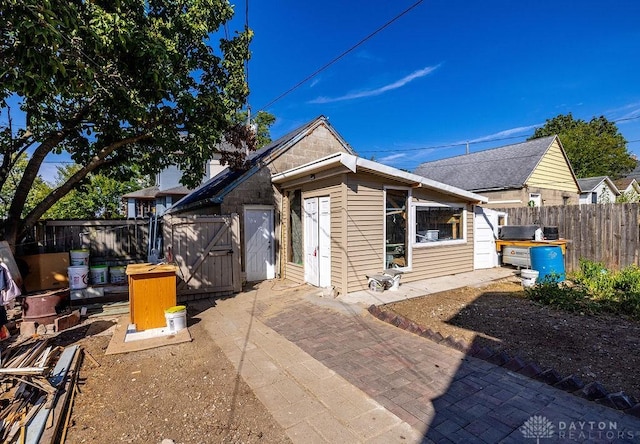 back of property featuring a patio area