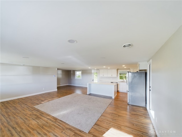 unfurnished living room featuring light hardwood / wood-style floors