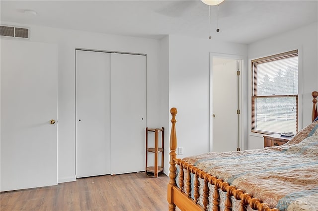 bedroom featuring ceiling fan and light hardwood / wood-style floors