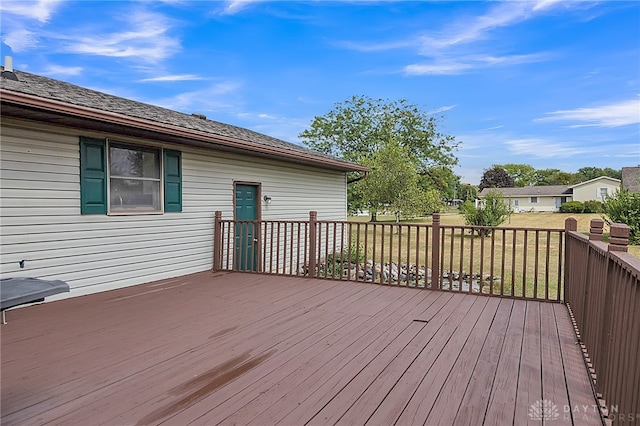 wooden terrace with a yard