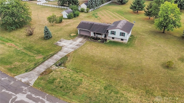 birds eye view of property with a rural view