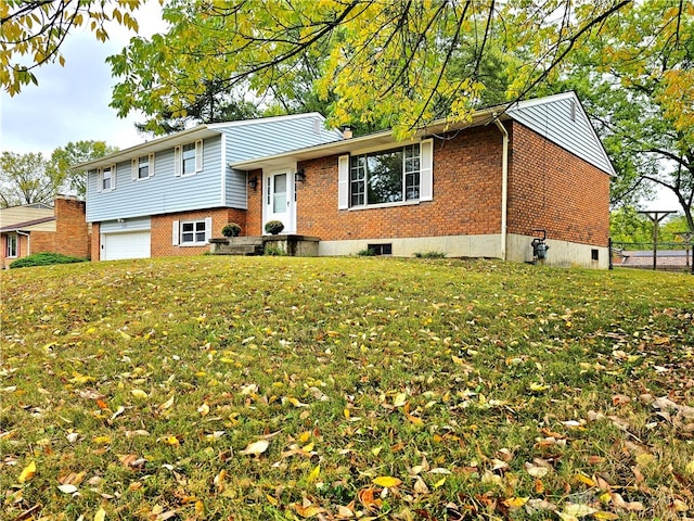 view of front of home with a front lawn and a garage