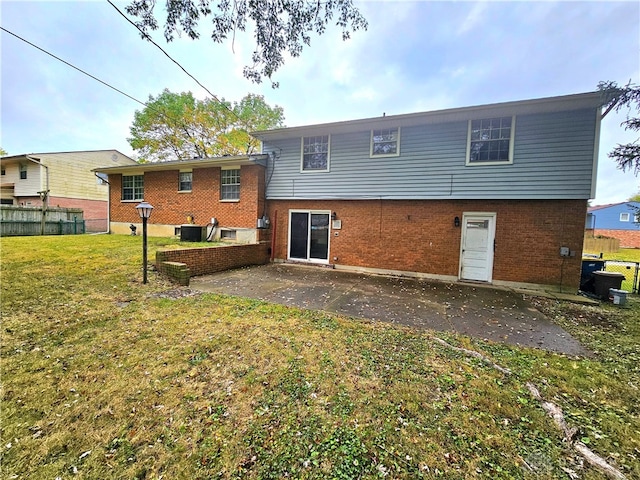 back of property featuring a yard, a patio, and central AC unit