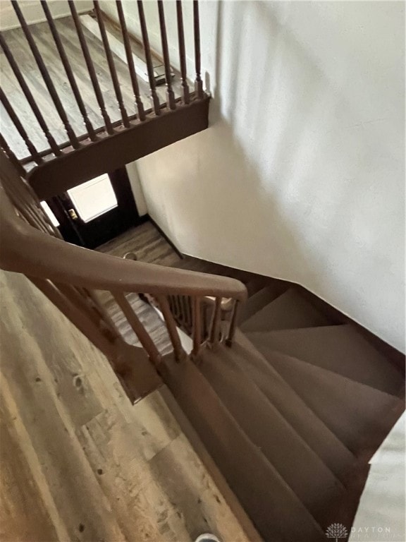 staircase featuring hardwood / wood-style flooring