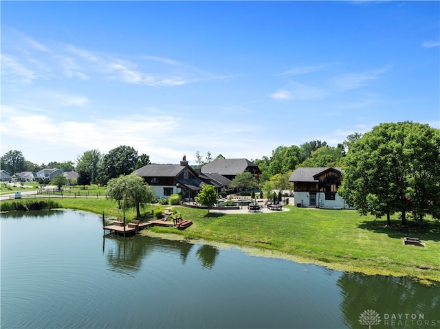 property view of water featuring an outdoor fire pit