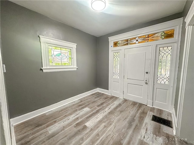 3501 Bevis Ave, Cincinnati, OH 45207 - foyer with light wood-style flooring, visible vents, and baseboards