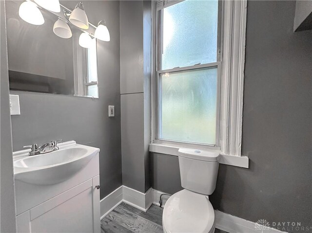 3501 Bevis Ave, Cincinnati, OH 45207 - half bath with a healthy amount of sunlight, toilet, and baseboards