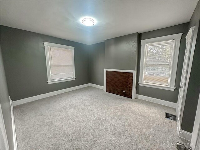 3501 Bevis Ave, Cincinnati, OH 45207 - spare room with baseboards, visible vents, and carpet