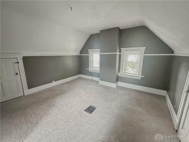 3501 Bevis Ave, Cincinnati, OH 45207 - bonus room with baseboards, vaulted ceiling, visible vents, and carpet