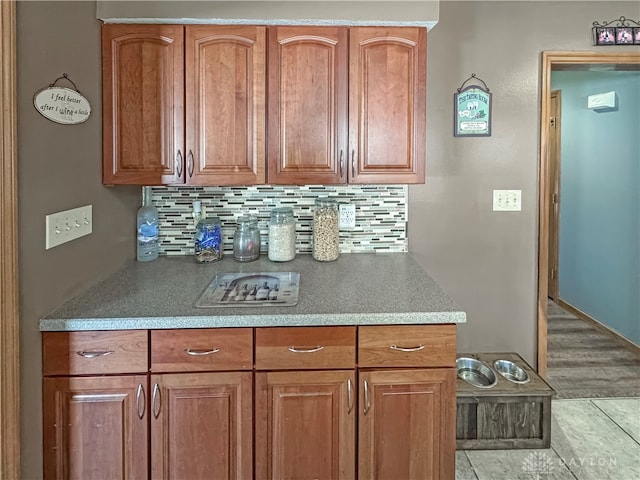 kitchen featuring decorative backsplash and light tile patterned floors