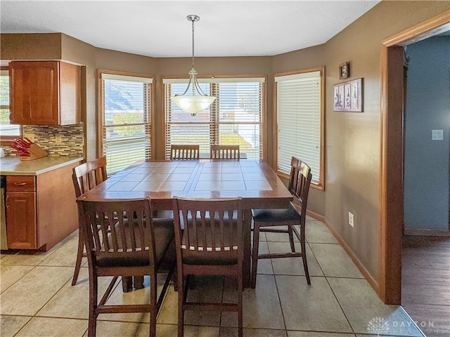 dining area featuring plenty of natural light and light tile patterned floors