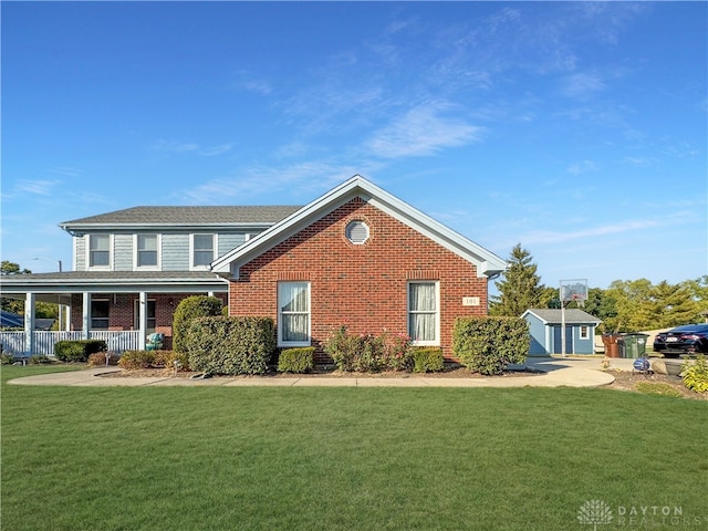 front of property with a front yard and a porch